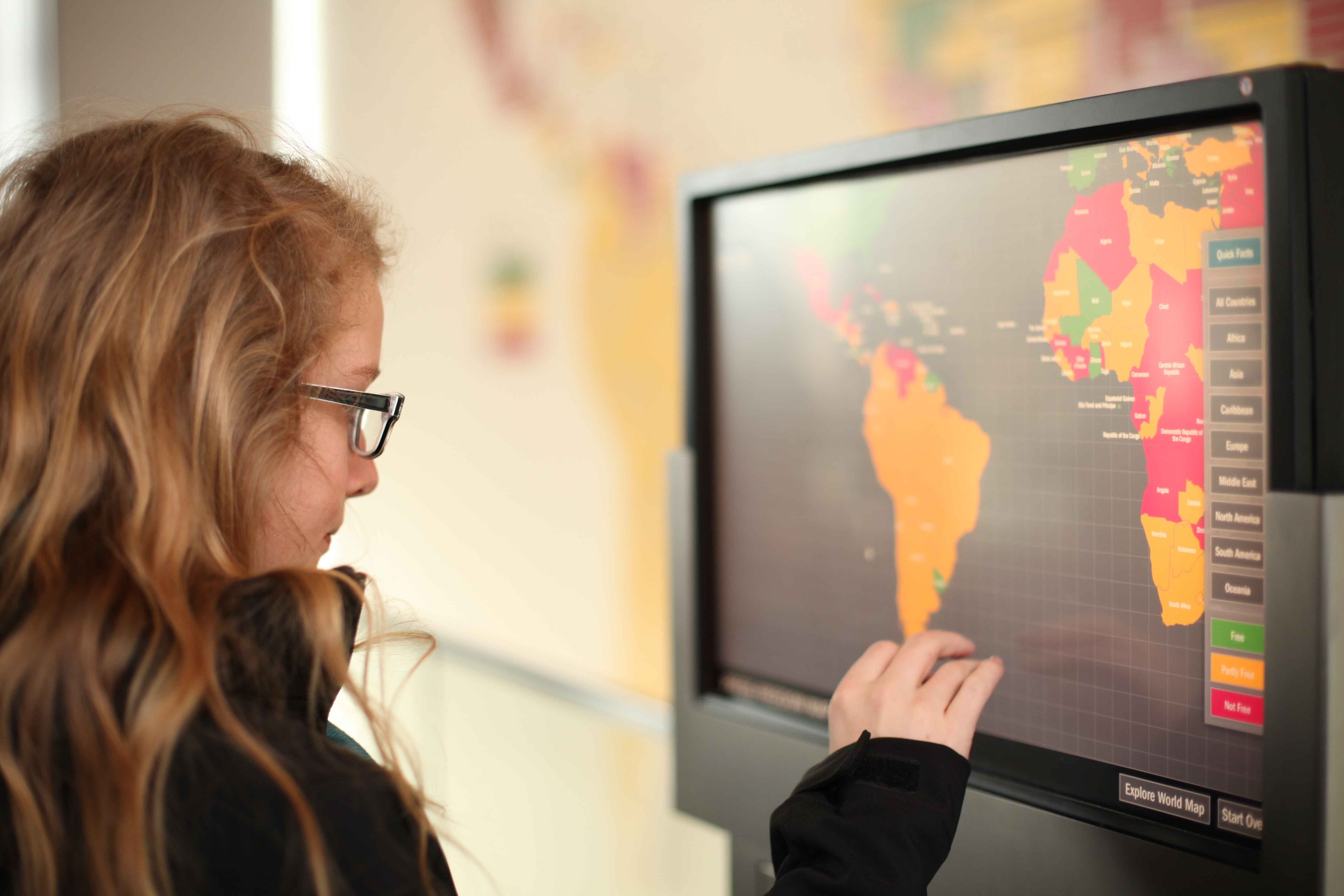 Girl looking at an interactive map at the Smithsonian, Washington D.C.