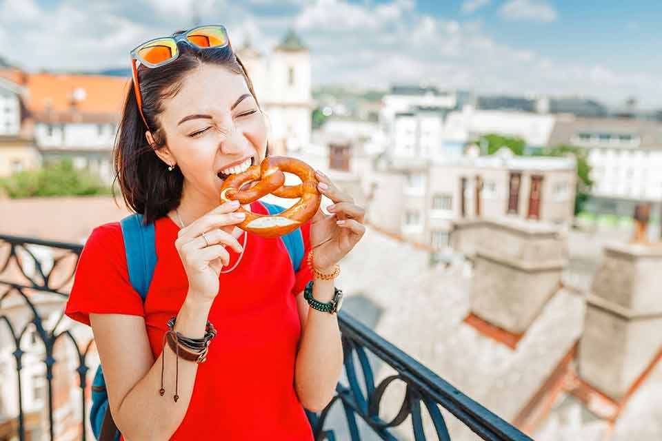 Student eating a pretzel